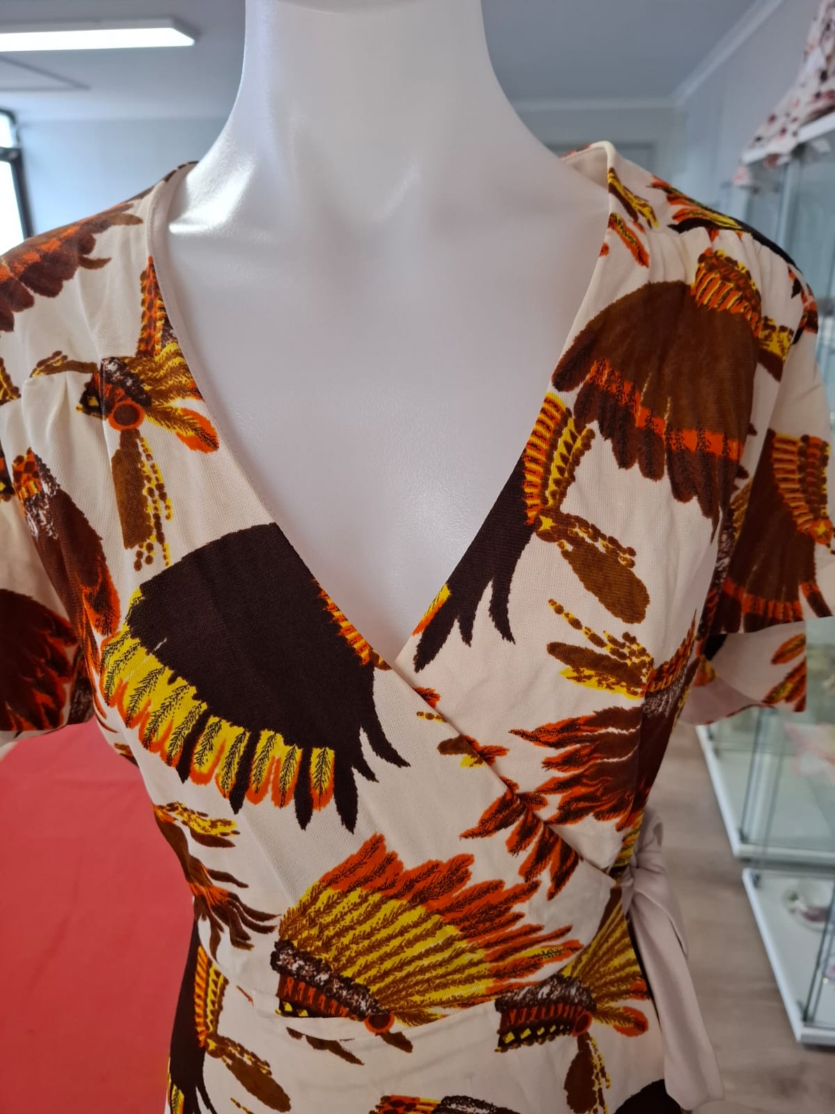 Short Sleeves Wrap around mini dress V- neck with butterfly sleeves. Belt included. Semi stretch.