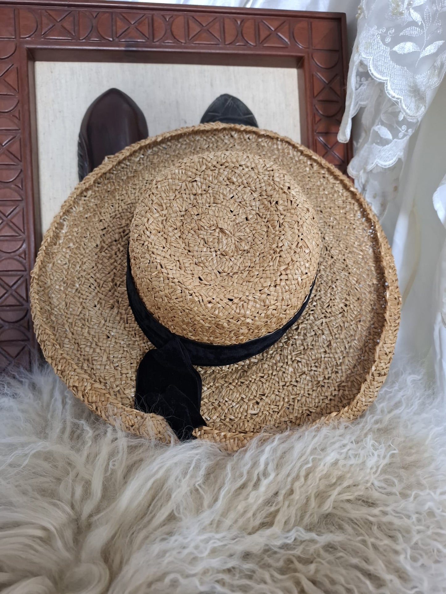 Maggy Hutchison Sun Kissed and Timeless-A wide-brimmed straw hat with a touch of contrast — finished with a black velvet ribbon for effortless elegance.