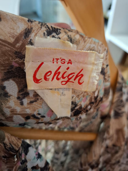70's - It's a Lehigh Night dress gown. Long sleeves see-through, round neck with tie design.Pleated and floral design.