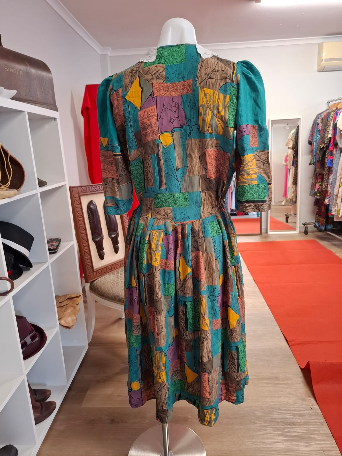 70's-80's Elbow puff sleeves. Embroidered design of the collar. Round neck. complete buttons down. Non stretch. Pleated skirts. Multi color design.