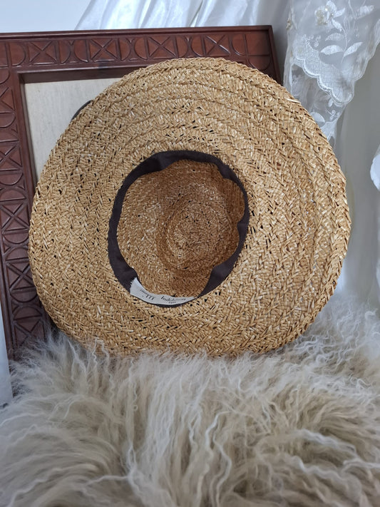 Maggy Hutchison  Sun Kissed and Timeless-A wide-brimmed straw hat with a touch of contrast — finished with a black velvet ribbon for effortless elegance.